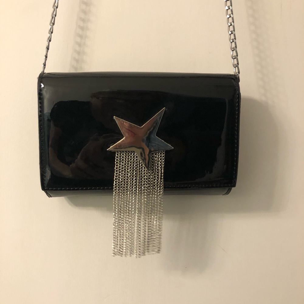 Small black purse with silver star